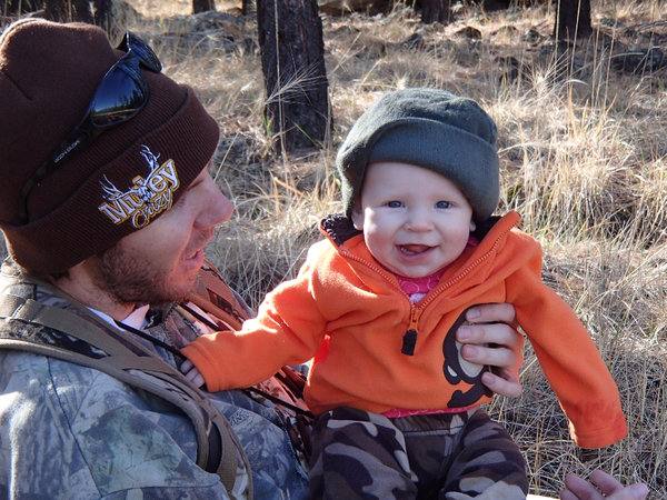 Photo of Dad and Infant Hunters