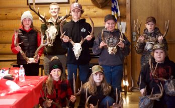 Photo of youth with their antlers